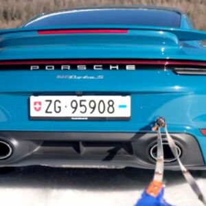 Porsche 911 992 Turbo S Snow Drifting While Towing a Skier